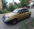 Желтый Дэу Ланос, объемом двигателя 1.5 л и пробегом 244 тыс. км за 1490 $, фото 1 на Automoto.ua