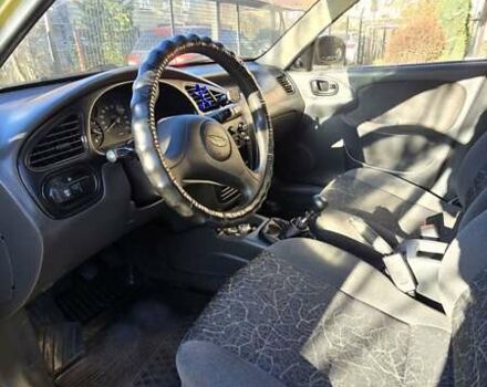 Желтый Дэу Ланос, объемом двигателя 1.5 л и пробегом 310 тыс. км за 1500 $, фото 9 на Automoto.ua