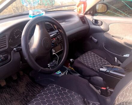 Желтый Дэу Ланос, объемом двигателя 1.4 л и пробегом 300 тыс. км за 1300 $, фото 5 на Automoto.ua