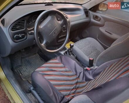 Желтый Дэу Ланос, объемом двигателя 1.6 л и пробегом 137 тыс. км за 1500 $, фото 11 на Automoto.ua