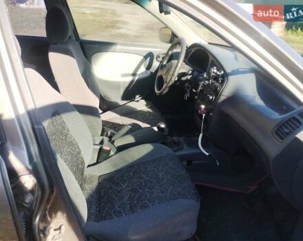 Серый Дэу Ланос, объемом двигателя 1.5 л и пробегом 220 тыс. км за 1021 $, фото 6 на Automoto.ua