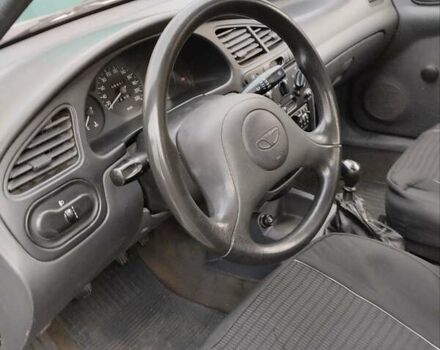 Сірий Деу Ланос, об'ємом двигуна 1.35 л та пробігом 117 тис. км за 1400 $, фото 2 на Automoto.ua