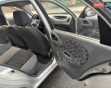 Сірий Деу Ланос, об'ємом двигуна 1.35 л та пробігом 116 тис. км за 1950 $, фото 11 на Automoto.ua