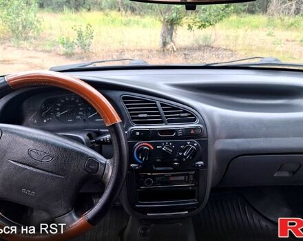 Серый Дэу Ланос, объемом двигателя 1.6 л и пробегом 220 тыс. км за 2650 $, фото 7 на Automoto.ua