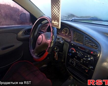 Серый Дэу Ланос, объемом двигателя 1.6 л и пробегом 200 тыс. км за 1500 $, фото 11 на Automoto.ua