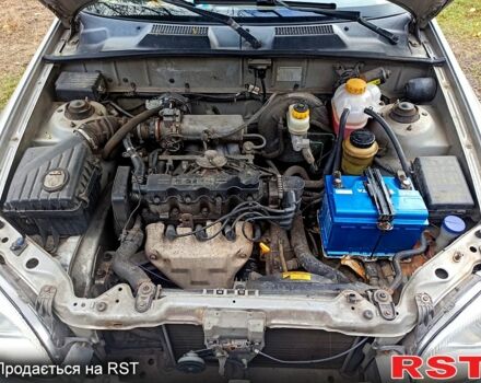 Серый Дэу Ланос, объемом двигателя 1.5 л и пробегом 306 тыс. км за 1950 $, фото 9 на Automoto.ua