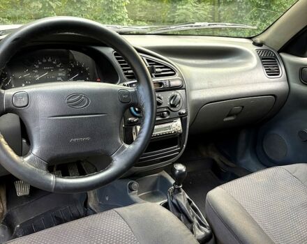 Серый Дэу Ланос, объемом двигателя 1.5 л и пробегом 170 тыс. км за 1950 $, фото 6 на Automoto.ua