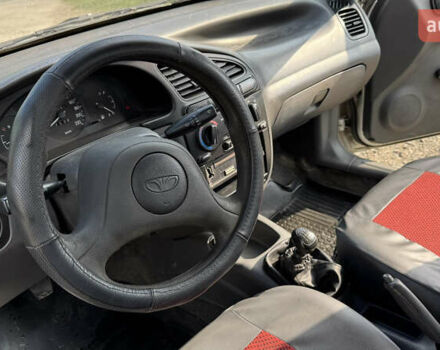 Серый Дэу Ланос, объемом двигателя 1.35 л и пробегом 180 тыс. км за 1250 $, фото 12 на Automoto.ua