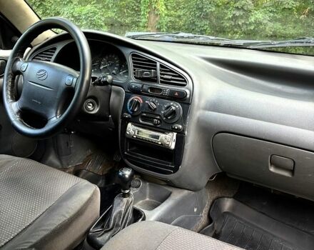 Серый Дэу Ланос, объемом двигателя 1.5 л и пробегом 170 тыс. км за 1950 $, фото 5 на Automoto.ua