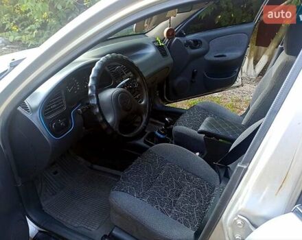 Серый Дэу Ланос, объемом двигателя 1.5 л и пробегом 306 тыс. км за 1950 $, фото 2 на Automoto.ua