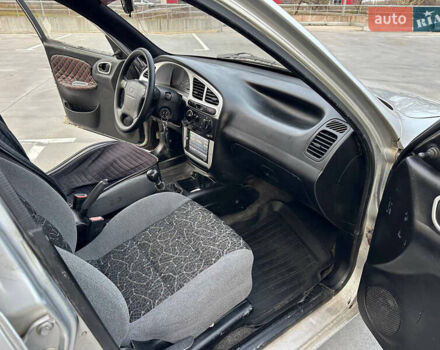 Сірий Деу Ланос, об'ємом двигуна 1.6 л та пробігом 305 тис. км за 1999 $, фото 4 на Automoto.ua