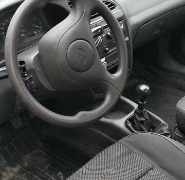 Серый Дэу Ланос, объемом двигателя 1.5 л и пробегом 280 тыс. км за 2000 $, фото 4 на Automoto.ua