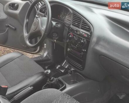 Серый Дэу Ланос, объемом двигателя 1.5 л и пробегом 156 тыс. км за 1950 $, фото 4 на Automoto.ua