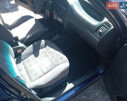 Синий Дэу Ланос, объемом двигателя 1.5 л и пробегом 304 тыс. км за 3500 $, фото 13 на Automoto.ua