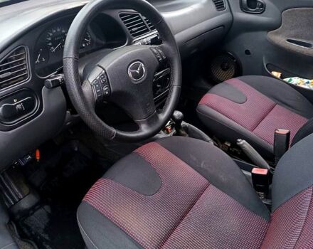 Синий Дэу Ланос, объемом двигателя 1.3 л и пробегом 153 тыс. км за 2000 $, фото 9 на Automoto.ua