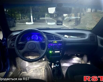 Синій Деу Ланос, об'ємом двигуна 1.4 л та пробігом 200 тис. км за 1999 $, фото 4 на Automoto.ua