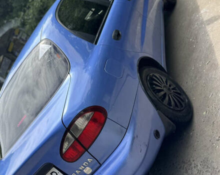 Синий Дэу Ланос, объемом двигателя 1.5 л и пробегом 250 тыс. км за 3600 $, фото 5 на Automoto.ua