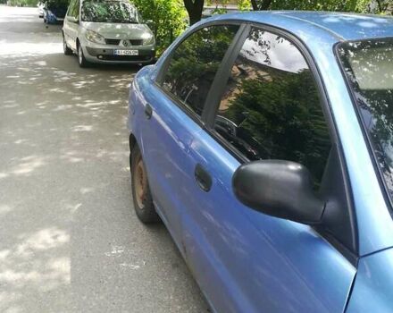 Синий Дэу Ланос, объемом двигателя 1.6 л и пробегом 135 тыс. км за 2000 $, фото 4 на Automoto.ua