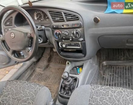 Синій Деу Ланос, об'ємом двигуна 1.39 л та пробігом 167 тис. км за 2400 $, фото 4 на Automoto.ua