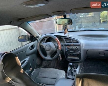 Синий Дэу Ланос, объемом двигателя 1.5 л и пробегом 100 тыс. км за 2000 $, фото 4 на Automoto.ua