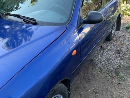 Синий Дэу Ланос, объемом двигателя 1.5 л и пробегом 100 тыс. км за 2000 $, фото 1 на Automoto.ua