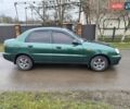 Зеленый Дэу Ланос, объемом двигателя 1.5 л и пробегом 300 тыс. км за 2000 $, фото 2 на Automoto.ua