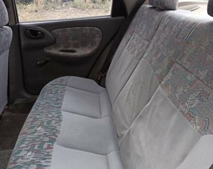 Зеленый Дэу Ланос, объемом двигателя 1.5 л и пробегом 280 тыс. км за 1400 $, фото 4 на Automoto.ua