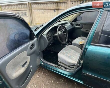 Зелений Деу Ланос, об'ємом двигуна 1.5 л та пробігом 200 тис. км за 1500 $, фото 17 на Automoto.ua