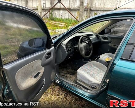 Зеленый Дэу Ланос, объемом двигателя 1.5 л и пробегом 200 тыс. км за 1400 $, фото 7 на Automoto.ua