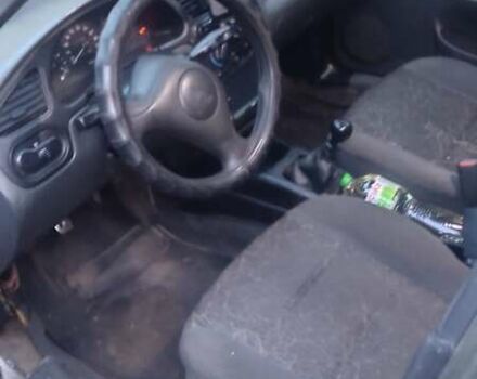 Зеленый Дэу Ланос, объемом двигателя 1.5 л и пробегом 283 тыс. км за 1950 $, фото 3 на Automoto.ua