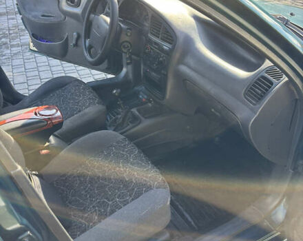 Зеленый Дэу Ланос, объемом двигателя 1.3 л и пробегом 385 тыс. км за 1250 $, фото 7 на Automoto.ua