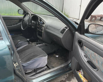 Зеленый Дэу Ланос, объемом двигателя 1.6 л и пробегом 233 тыс. км за 1900 $, фото 5 на Automoto.ua