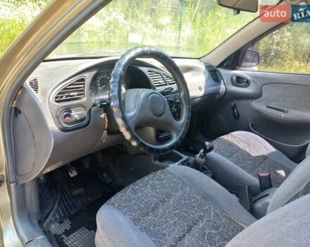 Зеленый Дэу Ланос, объемом двигателя 1.3 л и пробегом 215 тыс. км за 2000 $, фото 4 на Automoto.ua