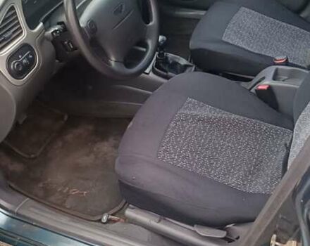 Зеленый Дэу Ланос, объемом двигателя 1.6 л и пробегом 291 тыс. км за 1999 $, фото 3 на Automoto.ua