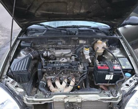 Зеленый Дэу Ланос, объемом двигателя 1.5 л и пробегом 332 тыс. км за 1650 $, фото 7 на Automoto.ua