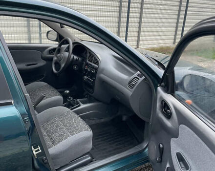 Зеленый Дэу Ланос, объемом двигателя 1.5 л и пробегом 133 тыс. км за 2200 $, фото 8 на Automoto.ua