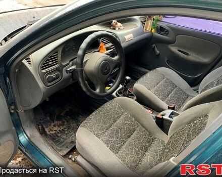 Зеленый Дэу Ланос, объемом двигателя 1.4 л и пробегом 280 тыс. км за 2000 $, фото 6 на Automoto.ua