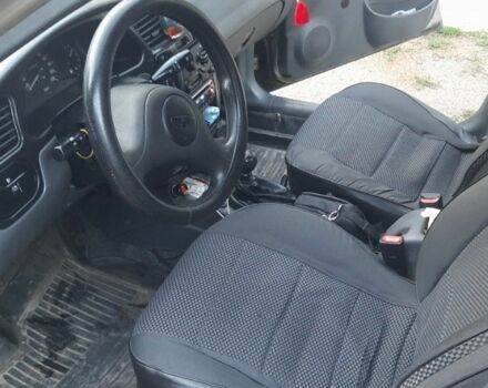 Зеленый Дэу Ланос, объемом двигателя 1.5 л и пробегом 120 тыс. км за 3000 $, фото 4 на Automoto.ua