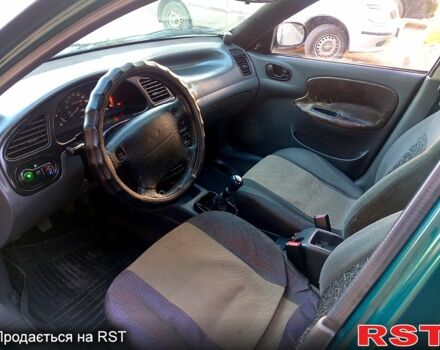 Зелений Деу Ланос, об'ємом двигуна 1.4 л та пробігом 180 тис. км за 2000 $, фото 4 на Automoto.ua