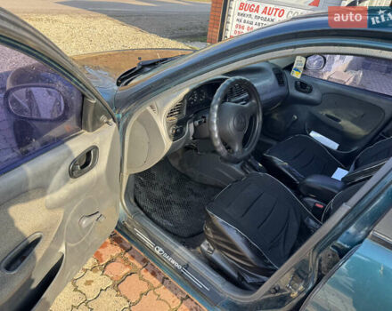 Зеленый Дэу Ланос, объемом двигателя 1.5 л и пробегом 170 тыс. км за 1900 $, фото 8 на Automoto.ua