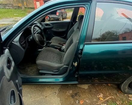 Зеленый Дэу Ланос, объемом двигателя 1.5 л и пробегом 230 тыс. км за 2250 $, фото 4 на Automoto.ua