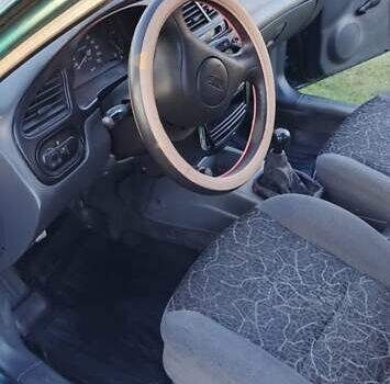 Зеленый Дэу Ланос, объемом двигателя 1.39 л и пробегом 215 тыс. км за 1800 $, фото 6 на Automoto.ua