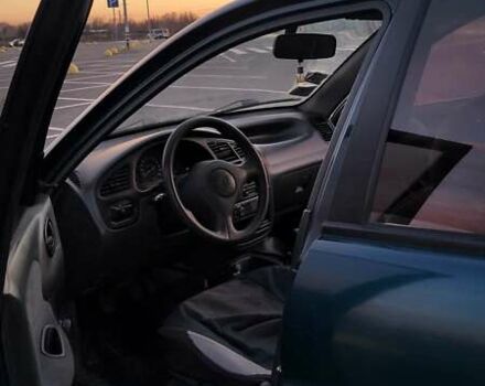 Зеленый Дэу Ланос, объемом двигателя 1.39 л и пробегом 198 тыс. км за 1999 $, фото 3 на Automoto.ua