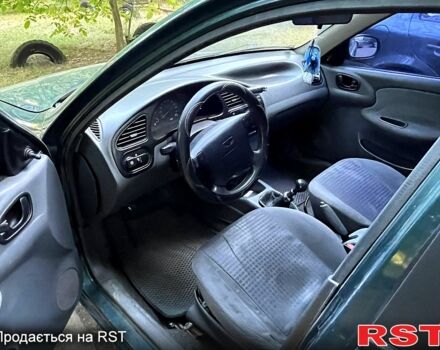 Зеленый Дэу Ланос, объемом двигателя 1.6 л и пробегом 257 тыс. км за 3300 $, фото 2 на Automoto.ua