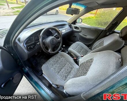 Зеленый Дэу Ланос, объемом двигателя 1.5 л и пробегом 200 тыс. км за 1500 $, фото 8 на Automoto.ua