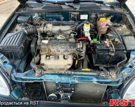 Дэу Ланос 2007 в Запорожье на Automoto.ua Зеленый Дэу Ланос, объемом двигателя 1.5 л и пробегом 154 тыс. км за 1650 $, фото 13 на Automoto.ua