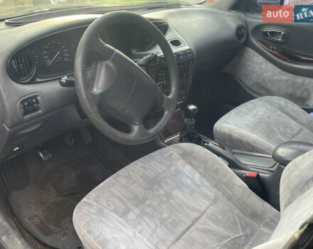 Коричневый Дэу Леганза, объемом двигателя 2 л и пробегом 250 тыс. км за 1400 $, фото 4 на Automoto.ua