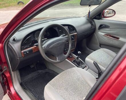 Красный Дэу Леганза, объемом двигателя 2 л и пробегом 185 тыс. км за 2450 $, фото 5 на Automoto.ua