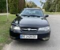 Чорний Деу Нексія, об'ємом двигуна 1.6 л та пробігом 330 тис. км за 1300 $, фото 1 на Automoto.ua