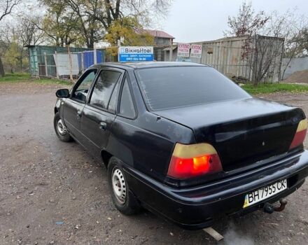 Чорний Деу Нексія, об'ємом двигуна 1.5 л та пробігом 150 тис. км за 1000 $, фото 1 на Automoto.ua